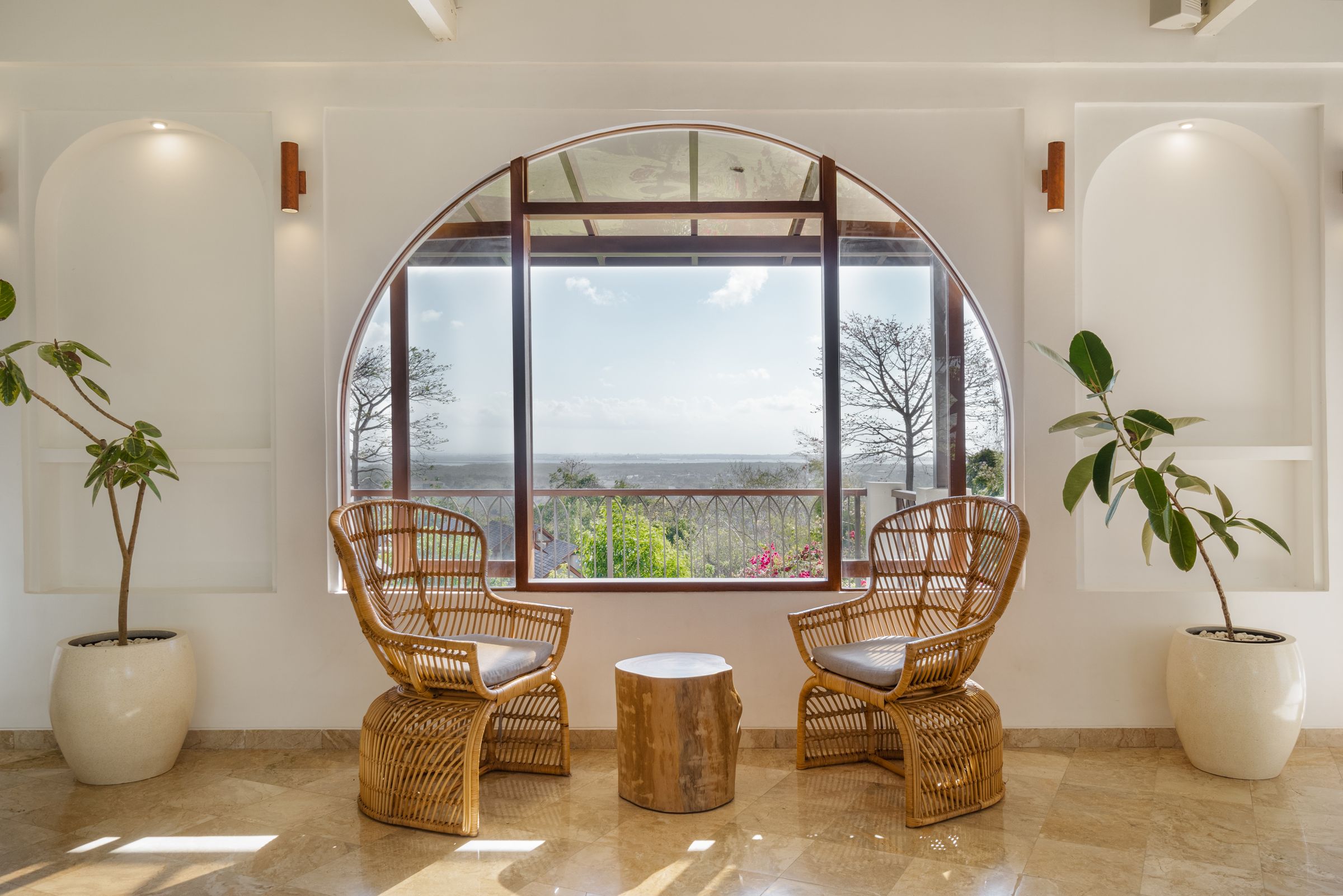 Round window and rattan chairs