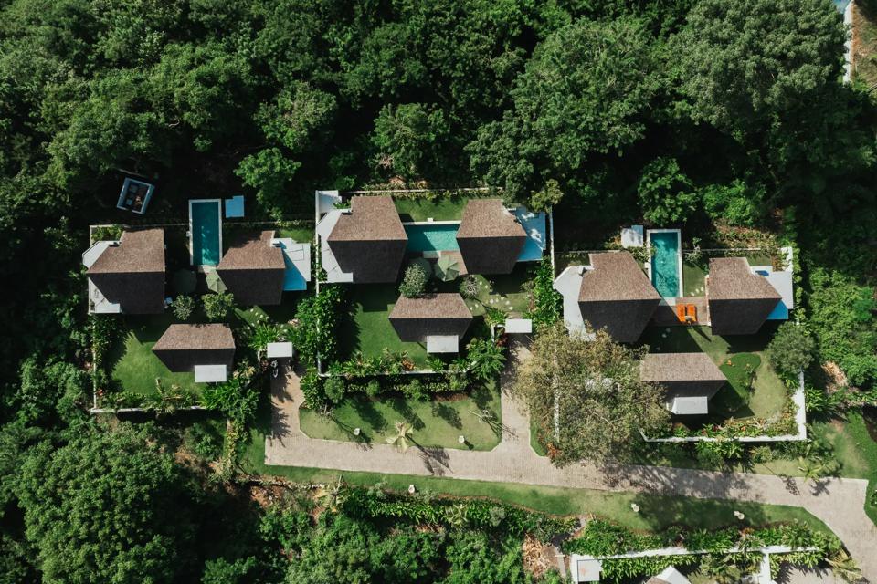 The villas from above, set into the forest