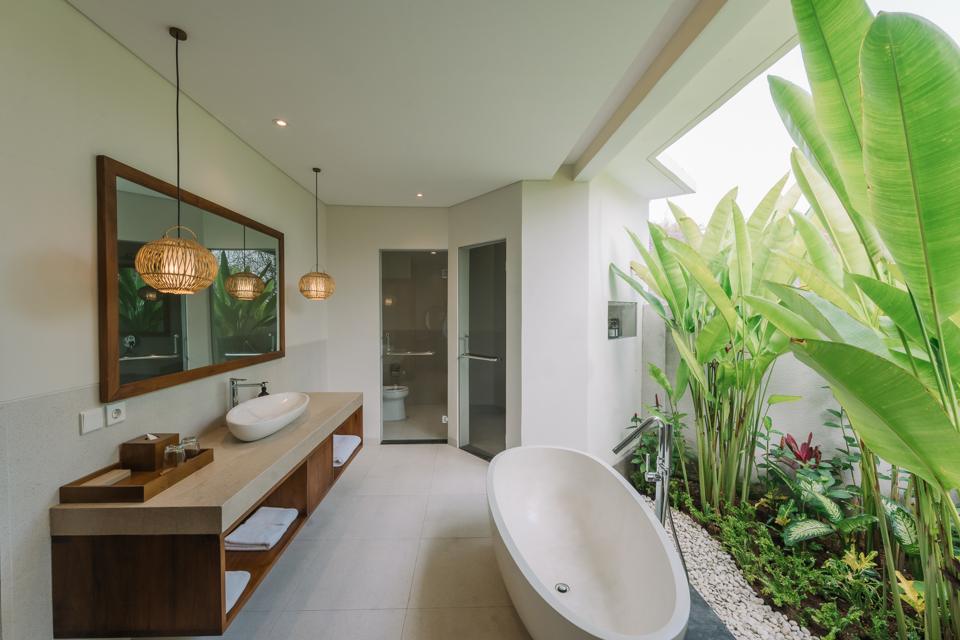 Bathroom open to a planted courtyard