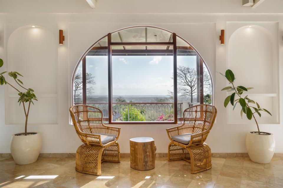 Round window and rattan chairs