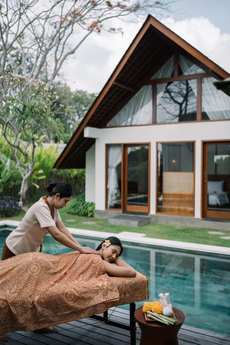 Massage beside a villa pool